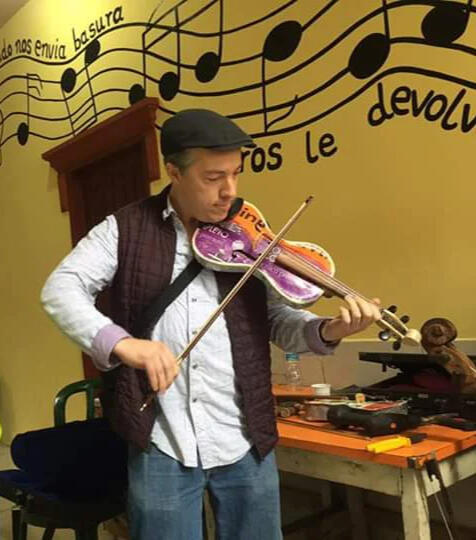 Daniel Piper plays violin from the Recycled Orchestra of Paraguay Curator, ethnomusicologist, and public educator Daniel Piper plays a violin made from recycled materials in the small town of Cateura, Paraguay while visiting the Orquesta Reciclada